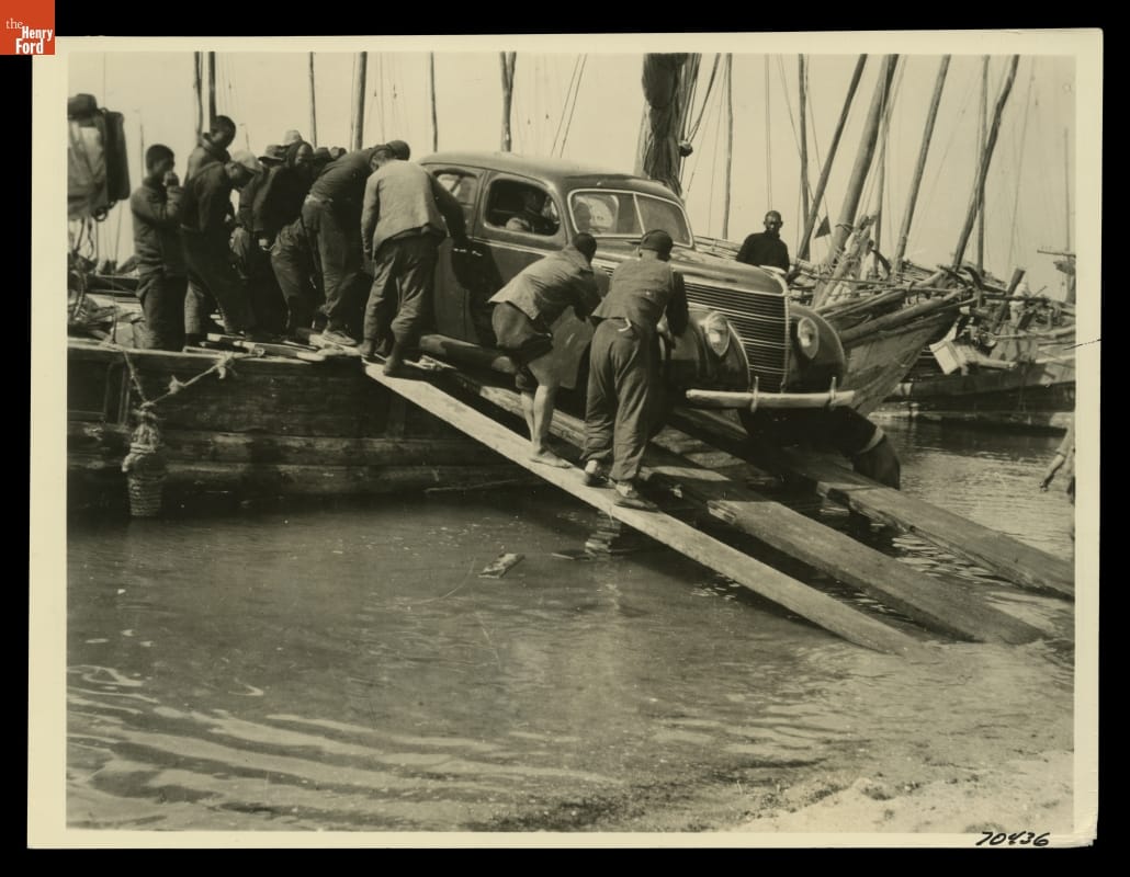 Ford V-8 Standard Fordor Sedan Being Unloaded from Junk (Boat) by Chinese Laborers, Tsingtao Harbor, China, 1938