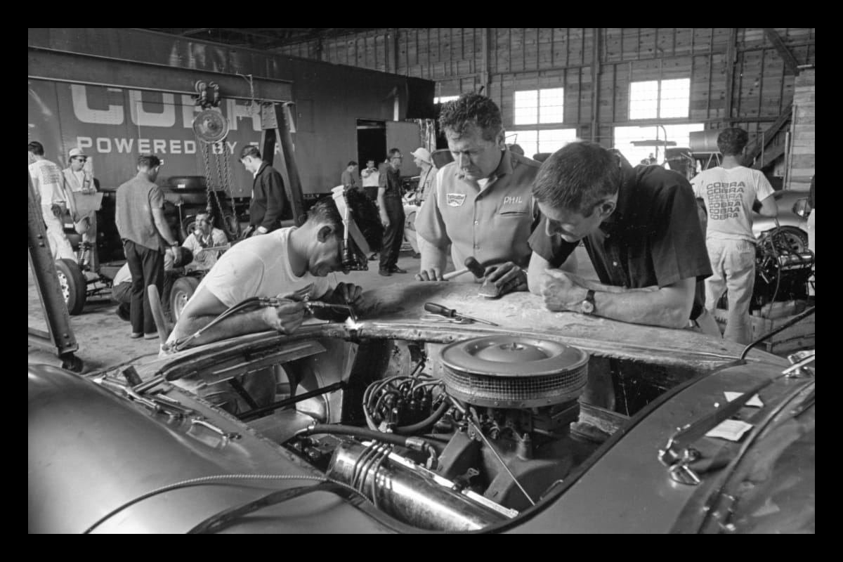 Ken Miles, Phil Remington and Mechanics Working on Shelby Cobra 427 Damaged during Practice Before 12 Hours of Sebring Race, March 1964