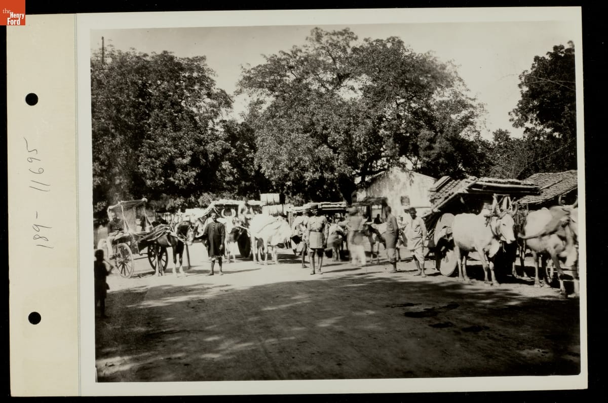 Pedestrians and Vehicles on a Road, circa 1930