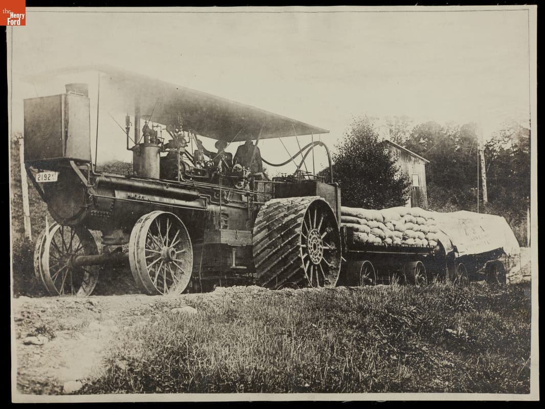Engineer and Fireman aboard Traction Engine, Pulling Load of Asbestos, circa 1910