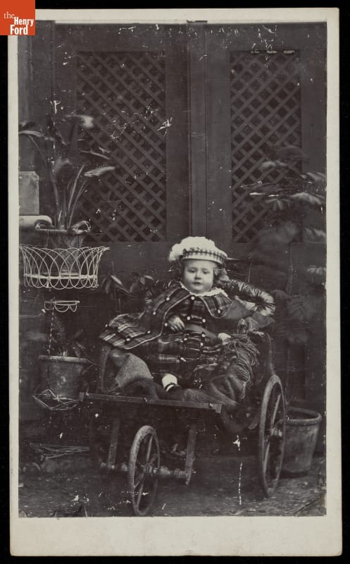 Child Seated in a Three-Wheeled Baby Carriage, 1868-1870