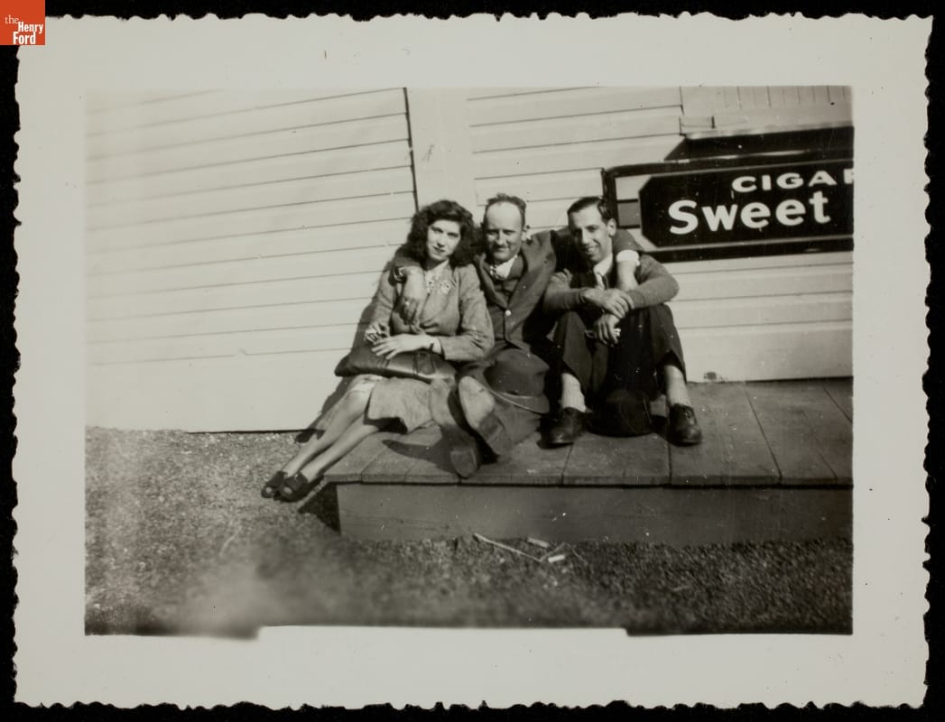 Tourists Posing near Cigar Sign, circa 1950