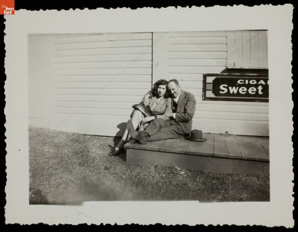 Tourists Posing near Cigar Sign, circa 1950