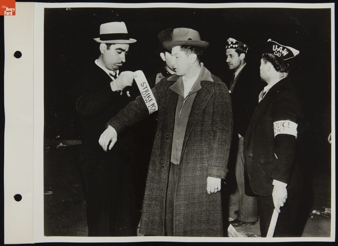 Union Strikers Putting on Identifying Arm Bands, April 1941