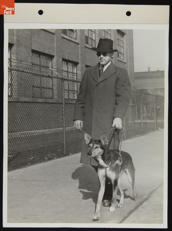 Ford Employee Sylvester Rypkowski with Service Dog "Blackie," October 1942