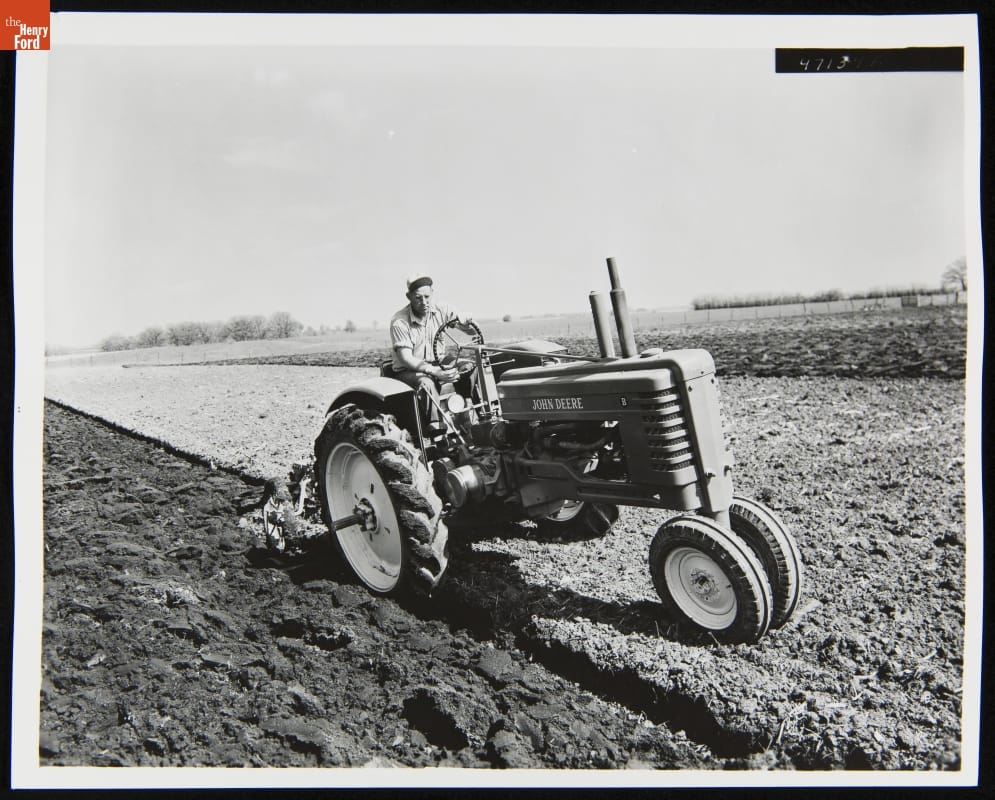 Man Using a 1947-1952 John Deere Model "B" Series Tractor