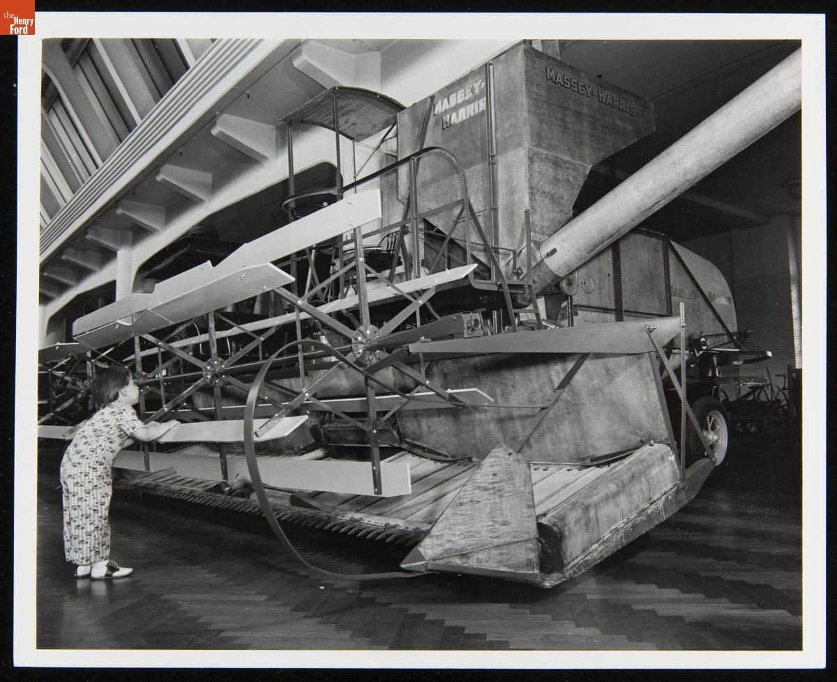 Child with the Massey-Harris Model 20 Self-Propelled Combine in Henry Ford Museum, June 1977