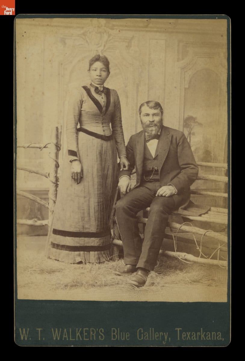 Seated Man and Standing Woman in a Photographer's Studio, 1885-1890