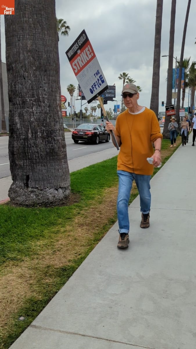Writers Guild of America Strike Picketer Holding Sign that Reads "Honk if You Love 'The Office'," June 3, 2023