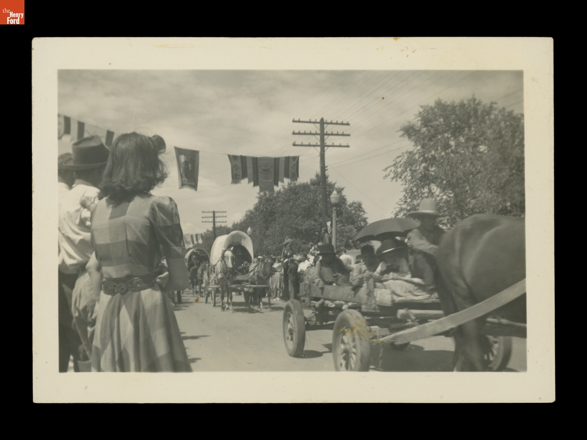 Horse Drawn Wagons Driving Down a Parade Route Likely Part of the Gallup Inter-Tribal Ceremonial, 1941