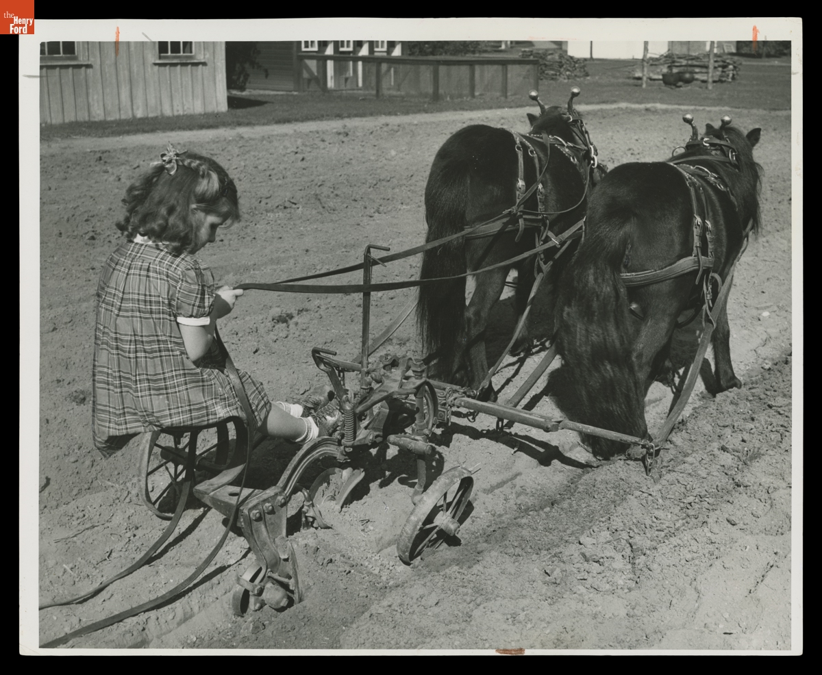 Edison Institute Schools Student Barbara Walker Driving a Miniature Sulky Plow in Greenfield Village, 1939