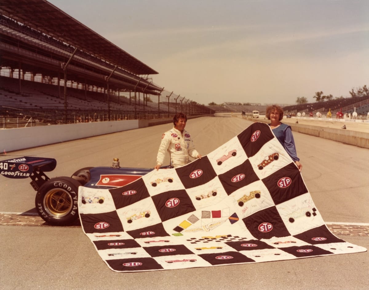 Mario Andretti with Jeanetta Holder and Her Quilt the Day after the 1981 Indianapolis 500 Race