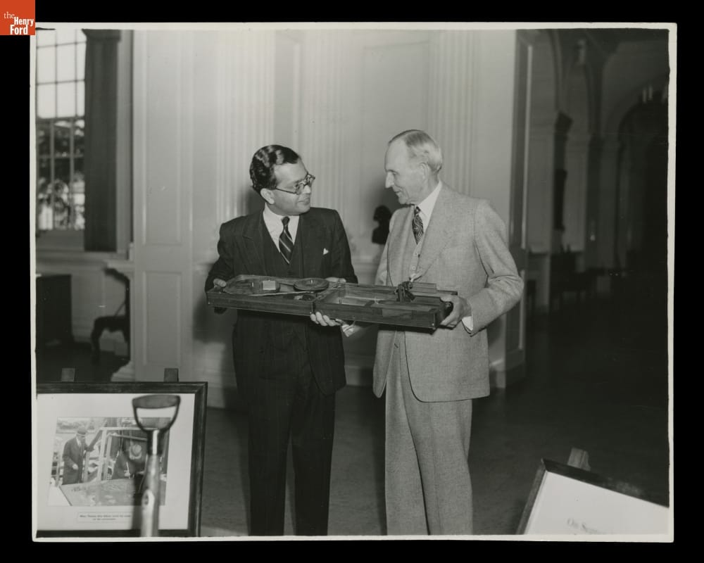 Mr. T. A. Raman Presents a Portable Spinning Wheel to Henry Ford, a Gift from Mahatma Gandhi, 1942